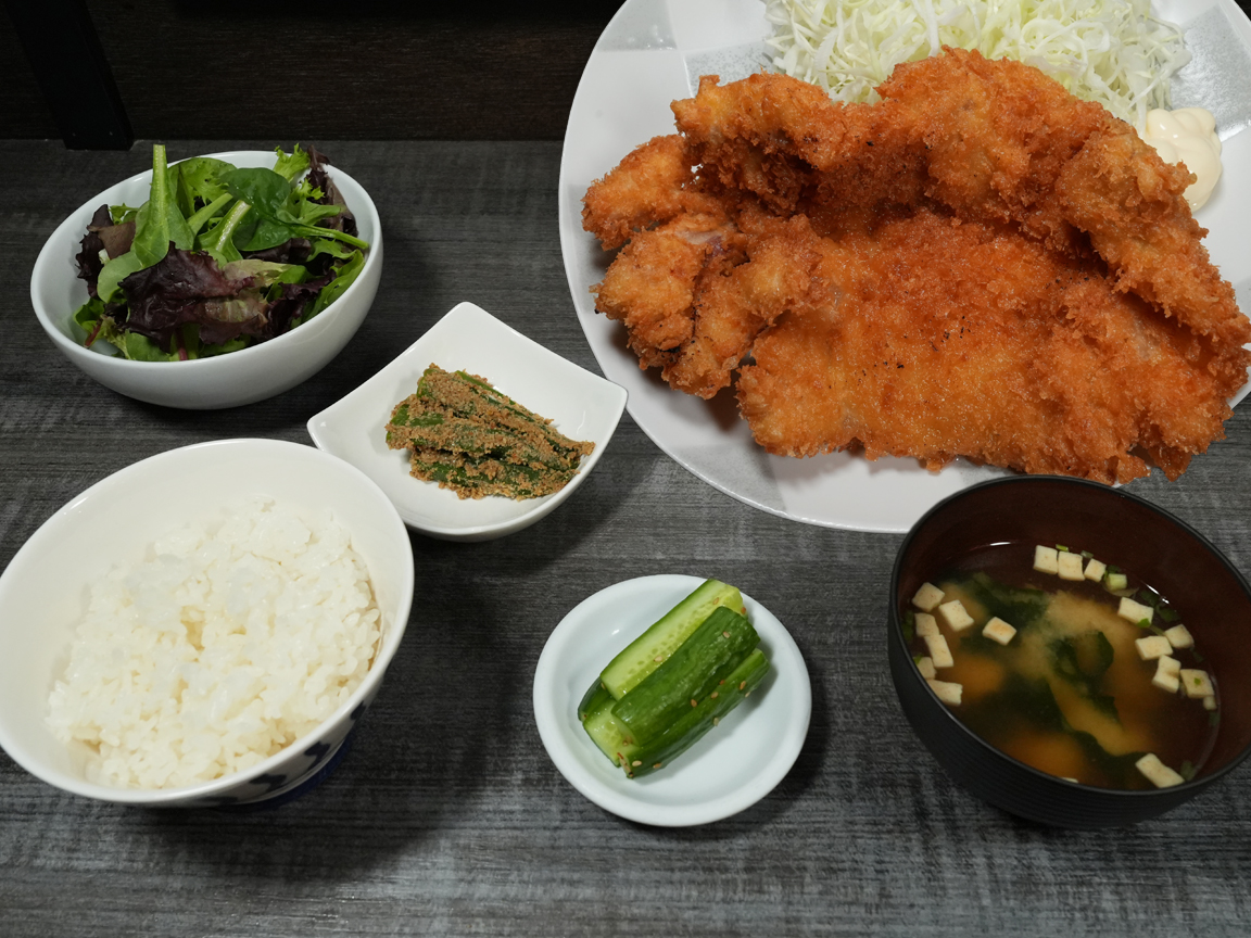 Big chicken cutlet teishoku with rice, miso soup, and side dishes at Torrance Yokocho